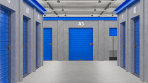 Indoor storage facility with numbered blue roll-up doors.